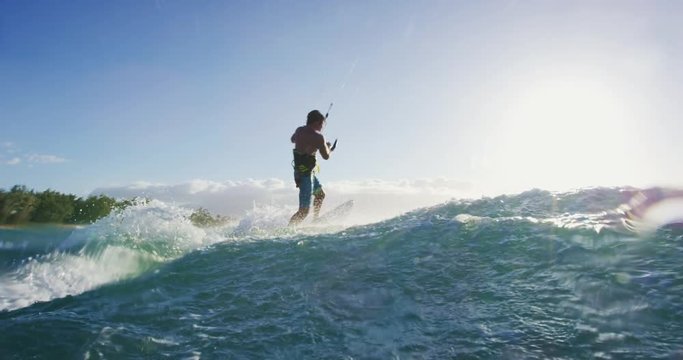 Young Man Kite Surfing in Slow Motion at Sunset in Blue Ocean