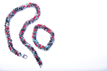 Color necklace  and bracelet a white background. Space for text