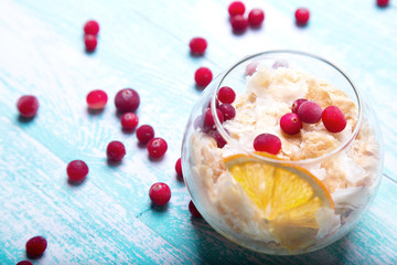 Gentle dessert with a pear and a cranberry in a glass. Soft and air cream. Dessert napoleon