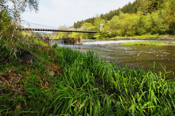 Fototapeta premium Stadlecky chain bridge and spring nature around, Czech republic.