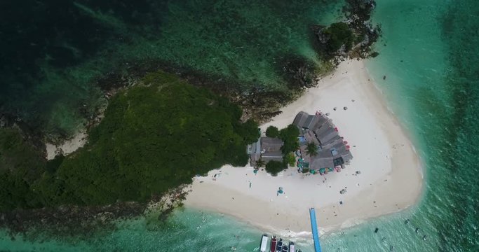 Aerial top view of tropical island Koh Khai Nai and sea with moored yachts