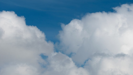 Obraz premium Fluffy,swirling clouds in the blue sky.