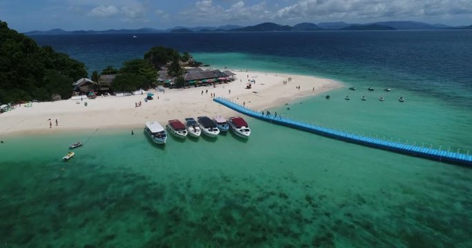Aerial view of tropical island Koh Khai Nai and sea with moored yachts