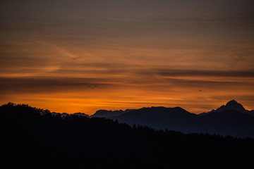 Colors of sunset with mountains in the background
