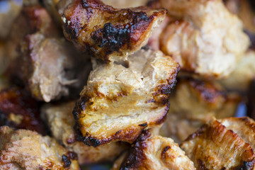 Pork shish kebab on a wooden table