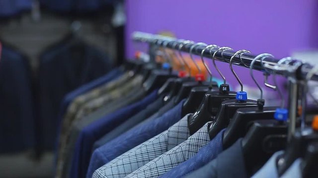 Men's jackets on hangers in the men's store