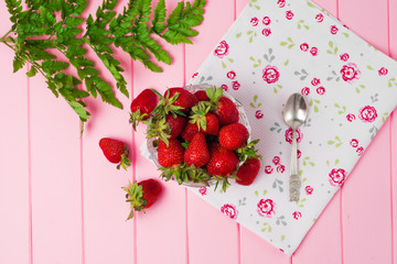 Ripe strawberries on wooden table. Fresh strawberries on wooden background