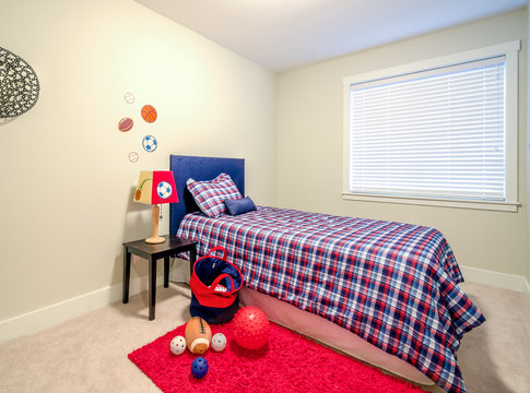 Children's boy's blue and red bedroom playroom. Interior design.