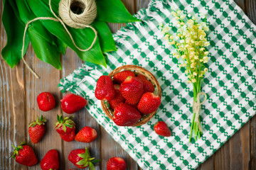 Ripe strawberries on wooden table. Fresh strawberries on wooden background