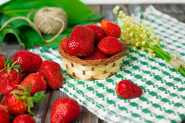 Ripe strawberries on wooden table. Fresh strawberries on wooden background