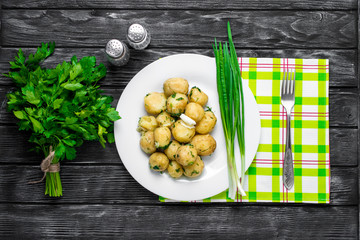 New Potatoes topped with chopped onion and sausage.