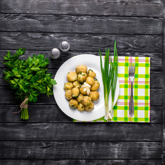 New Potatoes topped with chopped onion and sausage.