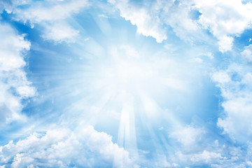 Sun rays shining bright in blue sky