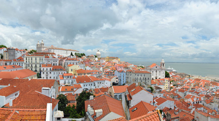 Obraz premium View of Alfama, and Monastery of Sao Vicente de Fora on sunny cloudy day, Lisbon Portugal