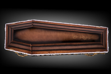 closed wooden brown coffin covered with cloth isolated on gray luxury background. casket with...
