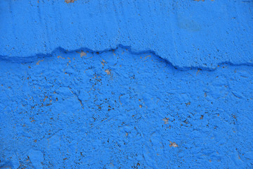 Blue painted rough concrete wall texture