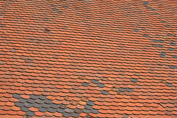 Old weathered red brown ceramic roof tiles