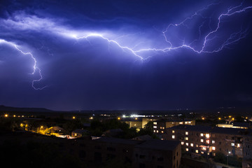 lightning in the sky in the city weather anomaly disaster