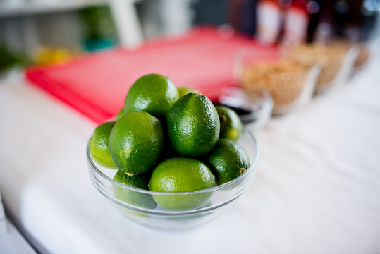 Fresh arranged limete- Lime with ingredients in background Fresh arranged limete with ingredients in background