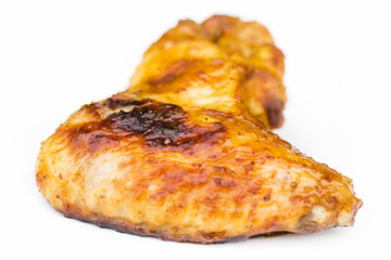 Grilled chicken wings, tray shot with selective focus