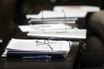 Business papers and documents in conference room