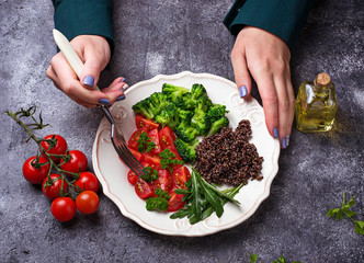 Woman eating  vegan salad