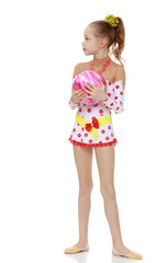 Gymnast does exercises with a ball