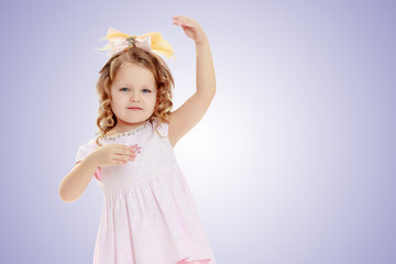 Girl shows the doll.