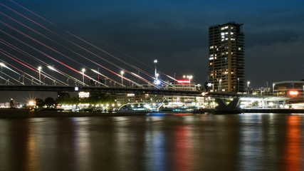 Fototapeta na wymiar Rotterdam, The Netherlands - May 2017: Erasmusburg bridge at night by Noordereiland