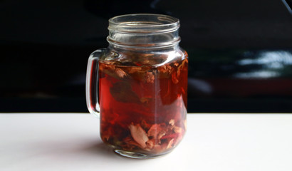 Wedang Uwuh, traditional herb drink from Jogjakarta, Indonesia. Contains a variety of leaves: cinnamon, nutmeg and cloves leaves. Another ingredient is wood from the secang tree, ginger and lump sugar