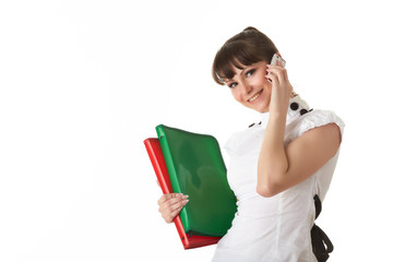 Young woman with folders and mobile phone