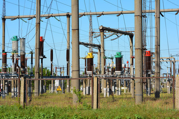 High-voltage power lines against the blue sky.
