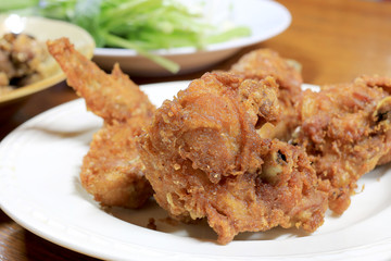 Spicy Deep Fried Breaded Chicken Wings in white dish on the table for dinner.