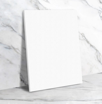 Blank white poster canvas in white glossy marble floor leaning at wall,Mock up template for display or montage of design or text,Business presentation