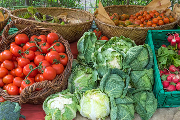 Tomatoes, cabbage and cauliflower for sale at a market