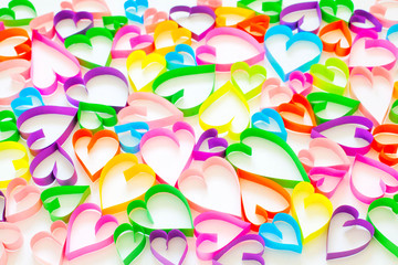 Fototapeta na wymiar Colorful hearts on white background. Postcard with hearts.
