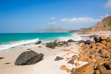 Wall murals turquoise sea white sand and rocky under sunshine very beautiful nature at Bai nhat beach Condao island - Vietnam.