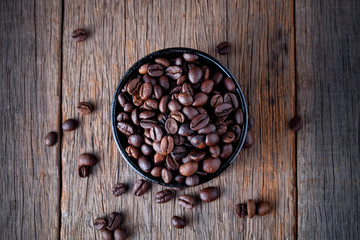 Obraz na płótnie Canvas Coffee beans on wooden floor Popular drinks