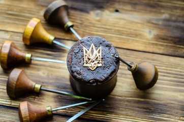 Gravers and trident on a jeweller workplace