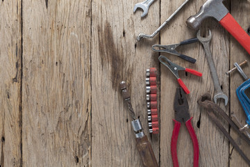 Old working tools on old wood background