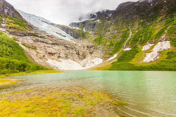 Naklejka na ściany i meble Boyabreen Glacier and lake in Norway