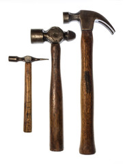Group of three vintage hammers on a white background