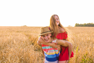 happy young loving couple having fun outdoor in summertime