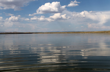Fototapeta premium the sky reflected in the water, deserted beach lake, summer sky, nature, blue cloud,