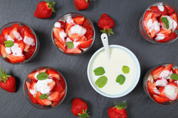 strawberries in glass jars with yogurt