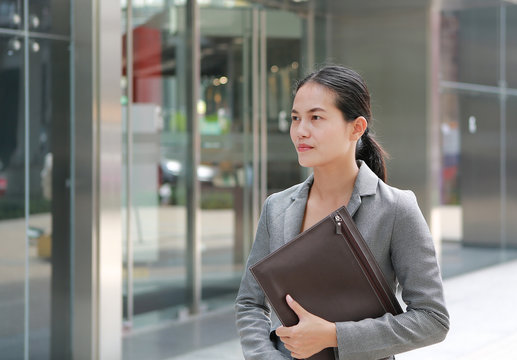 Beautiful Young Business Woman Walking Near Office Building.