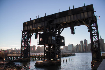 iconic gantries of Gantry State Park on the East river and buildings in Manhattan