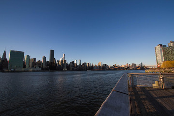 River between Manhattan and Gantry Plaza State Park with sunset sky