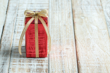 Gift box on the wooden table.