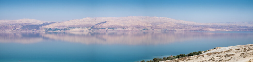 Naklejka na ściany i meble Large panoramic view of Dead sea beach at sunset. Jordan side. Shot taken from israeli side